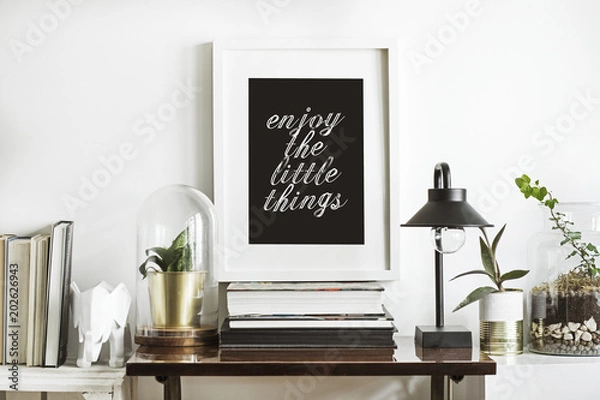 Fototapeta The room interior with white mock up frame, plants, wooden boxes, glass garden and stylish lamp. Concept of retro shelfie. 