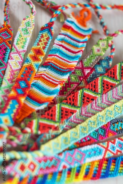 Fototapeta handmade friendship bracelets with colorful threads