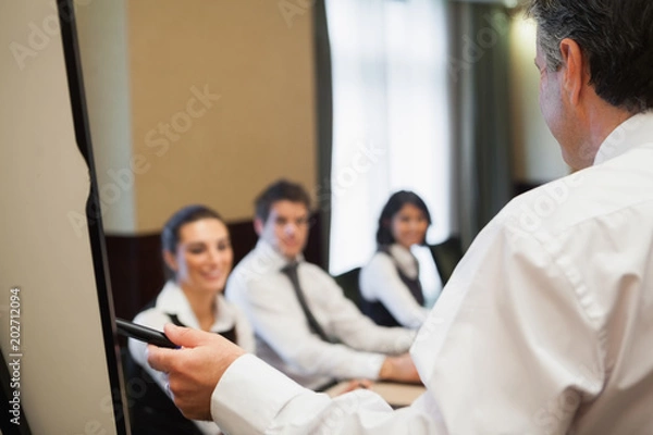 Fototapeta Man giving a business presentation