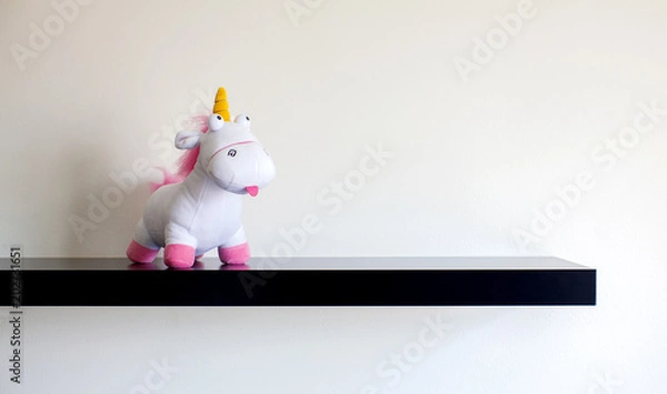 Obraz Stuffed unicorn standing on a shelf
