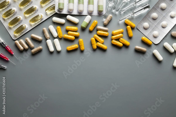 Fototapeta Different medicaments and empty space on gray background