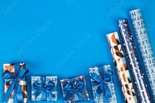 Obraz Gift boxes composition on blue background. Flat lay text space.