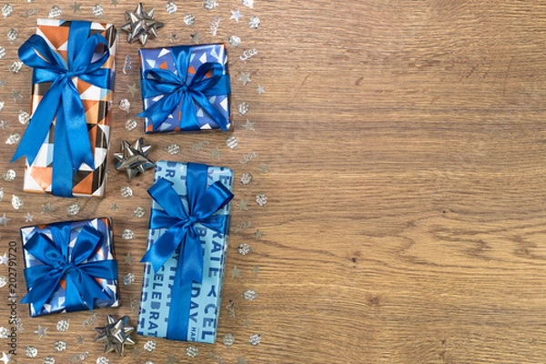 Obraz Gift boxes composition on wooden table. Flat lay text space.