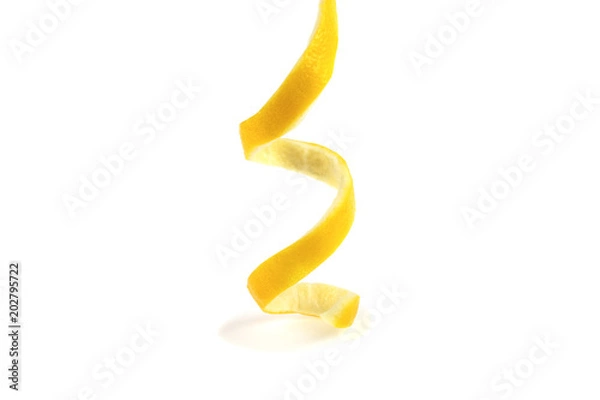 Fototapeta peeled lemon spiral on a white background