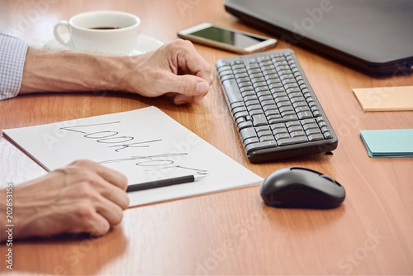 Obraz Closeup photo of male manager working with document and gesturing
