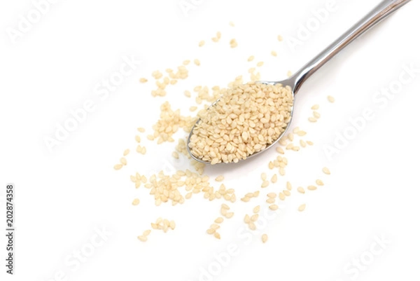 Fototapeta White sesame in a spoon on white background - isolated