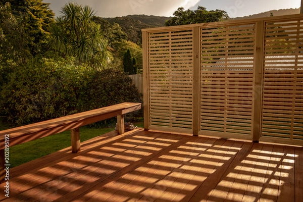 Obraz Sunsets Through Trellis Casting Shadows On Patio 