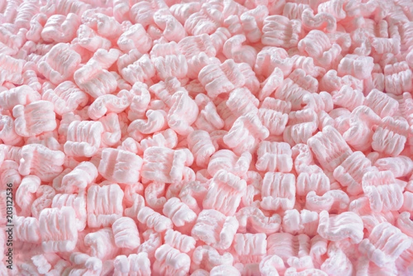 Obraz S-shaped pink packing peanuts as a background