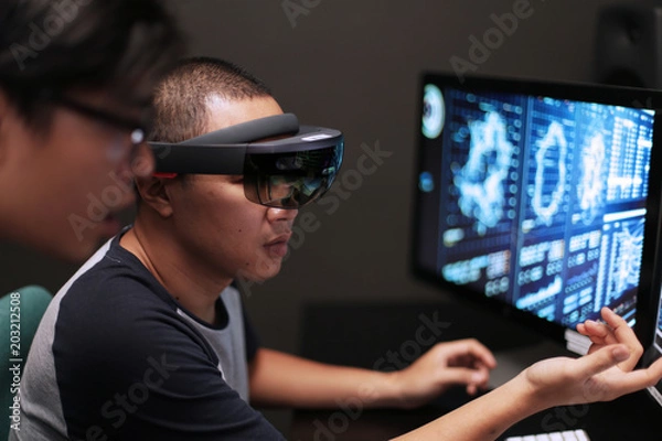 Fototapeta Students learn to use hololens in front of computer in the lab