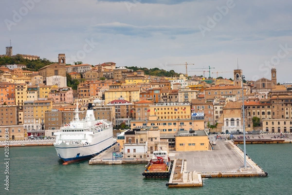 Fototapeta Cityscape of Ancona with ferries at the port viewed from the sea