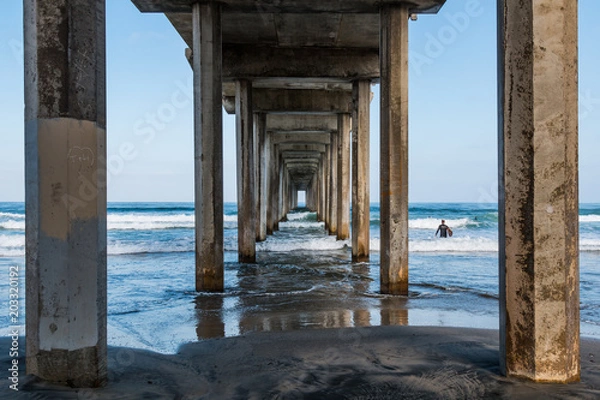 Obraz Beneath a symmetrical concrete pier in La Jolla, California.