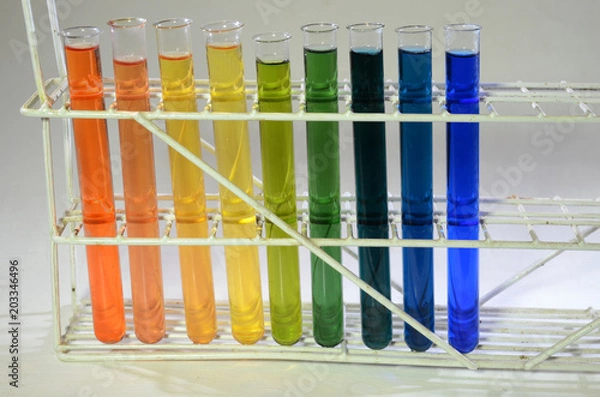 Fototapeta Different states of Bromothymol blue, from left red for strong acid, via weaker acids to green =neutral, then nuances of blue for different states of alkaline content.