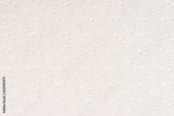 Fototapeta Beige self made paper pressed flowers sheet texture background. Embossed lace pattern. 
