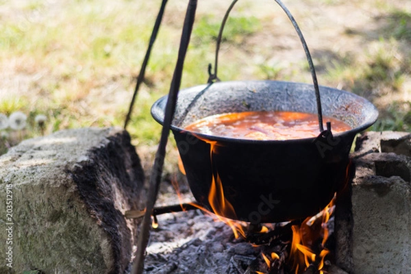 Obraz Gulyas stew boiling in a cauldron