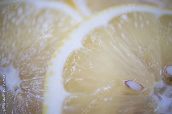 Fototapeta Juicy lemon in a cut, macro photo