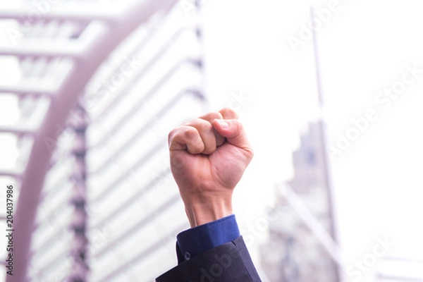 Fototapeta Handful of business man infront of blur background in win or success concept