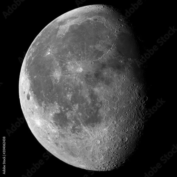 Obraz Close up of the entire Moon in its waning gibbous phase, with detailed craters on the right near the shadow, taken with large newtonian telescope and all in a black framed background.