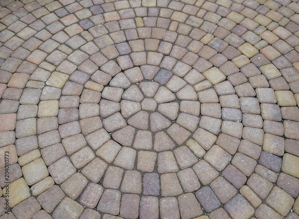 Fototapeta Background texture of paving slabs in circles.