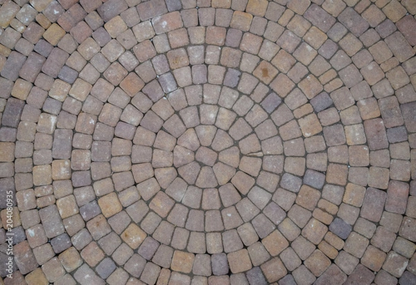 Fototapeta Background texture of paving slabs in circles.