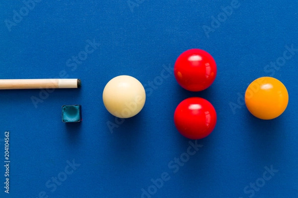Obraz Balls and a cue seen on the table of a Carom Billiard