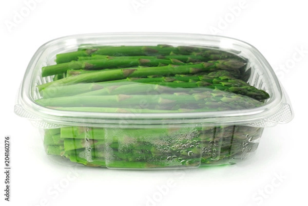 Fototapeta asparagus in plastic container isolated on white background 