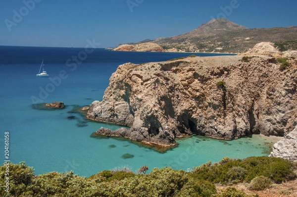 Fototapeta Yachting near the cliffs of Tsigrado beach at Milos island in Greece