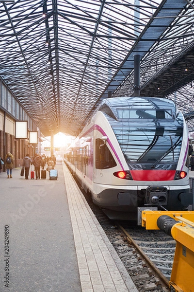 Fototapeta Modern speed train on the railway station