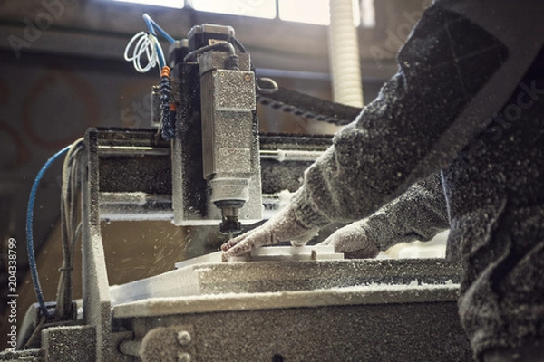 Fototapeta Man operating CNC Machine