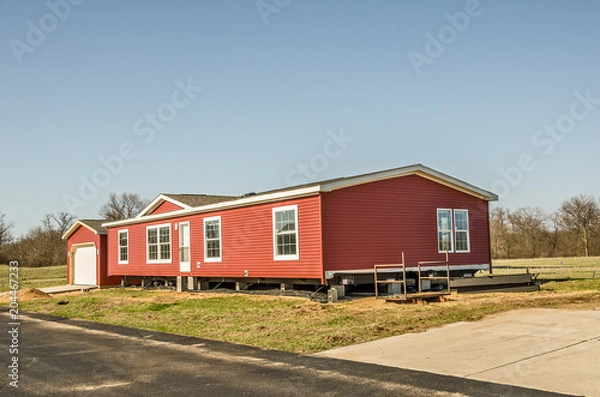 Obraz Red Vinyl Siding on New Manufactured Home