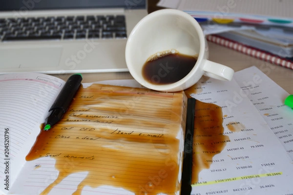 Fototapeta Spilled coffee on the desktop