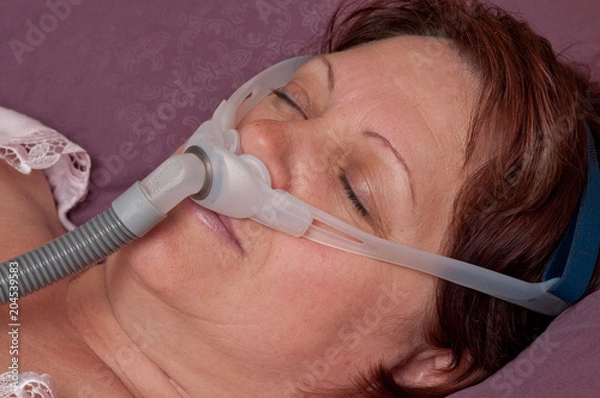 Fototapeta Frau mit Atemmaske