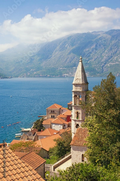 Fototapeta Beautiful Metiterranean landscape. Montenegro, Bay of Kotor. View of ancient town of Perast with  bell tower of Church of Our Lady of Rosary. Travel and tourism concept