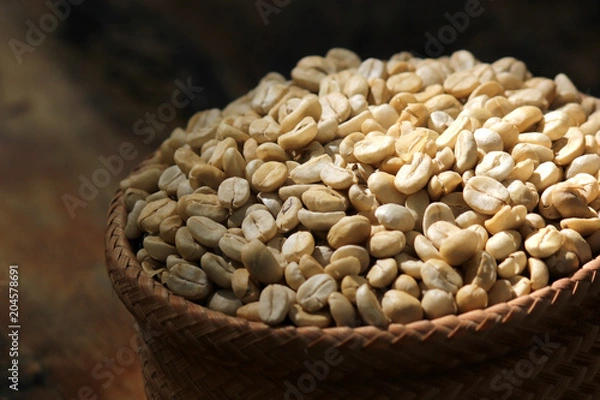 Obraz fresh coffee beans in wicker basket