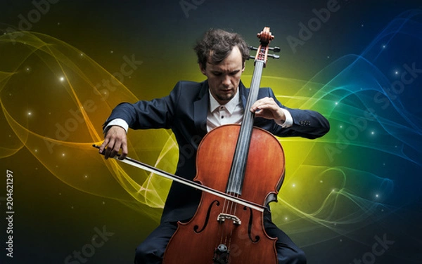 Fototapeta Serious classical cellist with fabled sparkling wallpaper