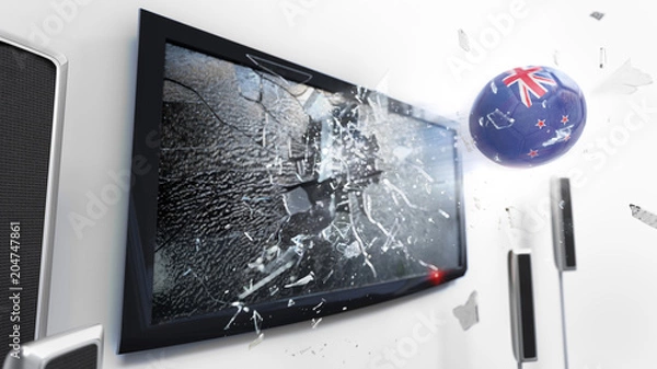 Fototapeta Soccer ball with the flag of New Zealand kicked through a shattering tv screen.(3D rendering series)