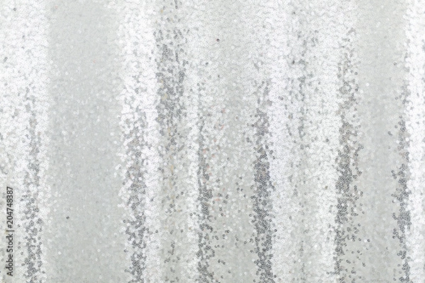 Fototapeta Silver sequins pattern texture fashion background. Horizontal close-up shot.