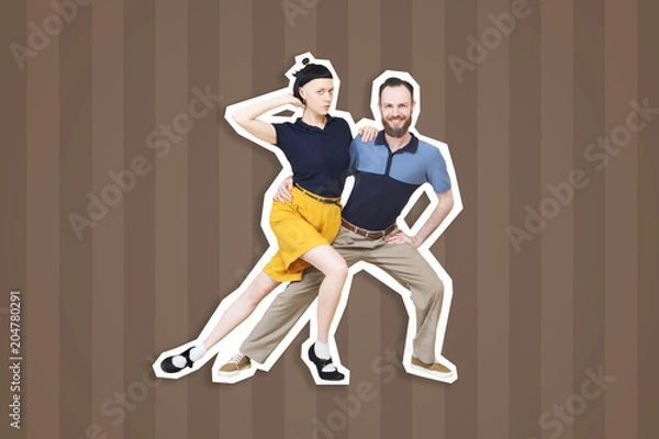 Fototapeta Lindy hop or rock'n'roll dance boogie woogie. Boogie acrobatic stunt in a studio background. Dance for rock-n-roll music.