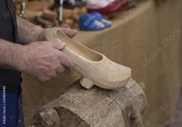 Obraz A craftsman is holding a madreña 