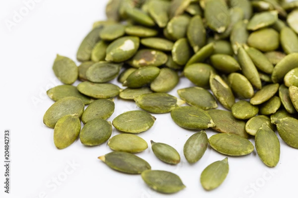 Obraz Pumpkin seeds on white background