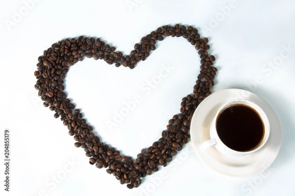 Fototapeta Coffee beans in the form of hearts with a cup