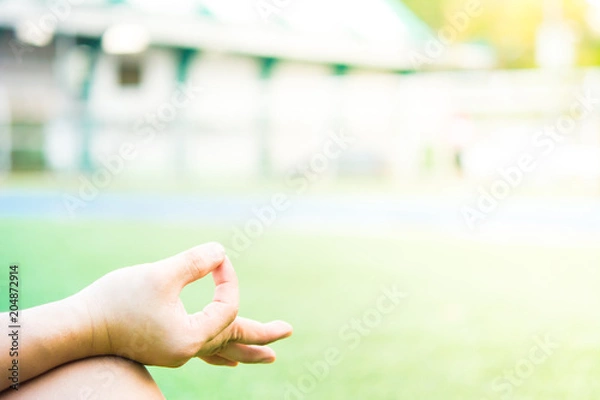 Fototapeta Hand of maditation person is maditating in stadium at day time