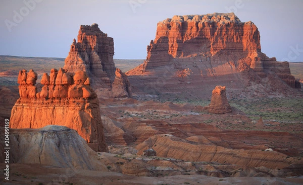 Fototapeta Sunrise overlooking desert formations