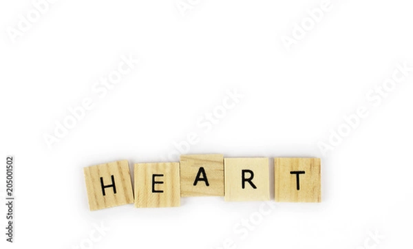 Obraz Wooden tiles spelling out the word heart on an isolated white background. Inspirational and motivational!  Room for text! 
