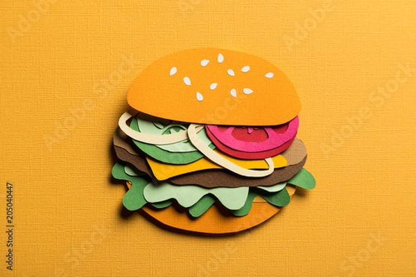 Fototapeta Creative art conceptual collage with space for text. Stylized craft paper burger a red background. Composition cut out from colored paper. Illustrative picture.
