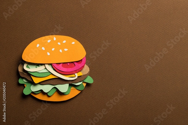 Fototapeta Creative art conceptual collage with space for text. Stylized craft paper burger a red background. Composition cut out from colored paper. Illustrative picture.
