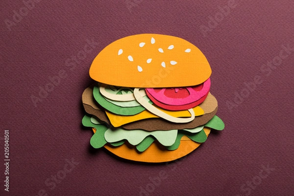 Fototapeta Creative art conceptual collage with space for text. Stylized craft paper burger a red background. Composition cut out from colored paper. Illustrative picture.