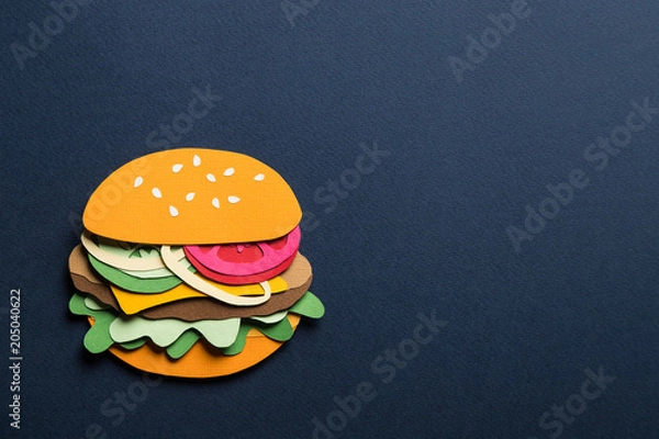 Fototapeta Creative art conceptual collage with space for text. Stylized craft paper burger a red background. Composition cut out from colored paper. Illustrative picture.
