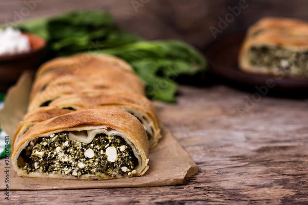 Obraz Pie or strudel with spinach and feta cheese