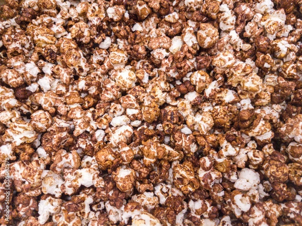 Fototapeta Scattered salted popcorn, texture background.