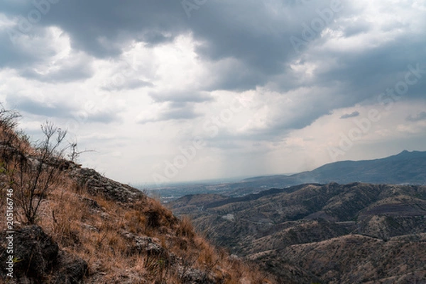 Obraz Mountain view with dark sky